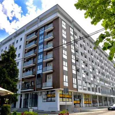 a large apartment building on a city street at apartmanjagodinaana 2 in Trnava