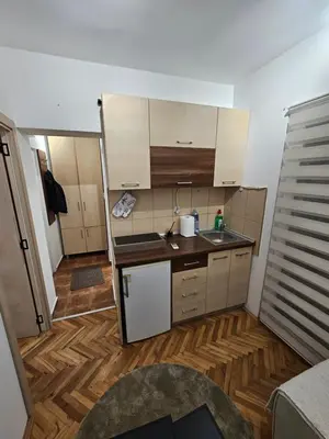 a small kitchen with a sink and a counter at Apartman Tara in Soko Banja