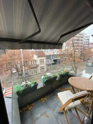 a view of a balcony with a table and chairs at LUCHIANO apartments in Niš