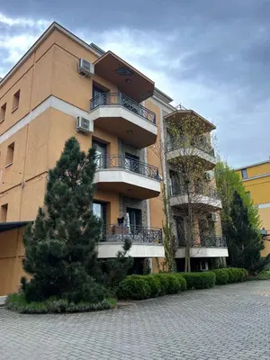 a building with balconies on the side of it at Apartman Tomić Vrnjacka Banja in Vrnjci