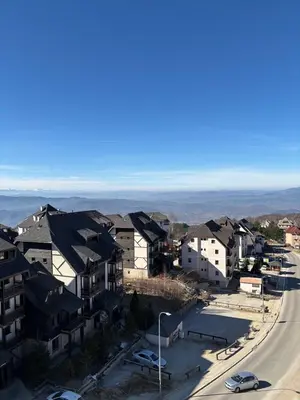 an aerial view of a city with houses and a street at SkyNest 605 Apartment in Kopaonik