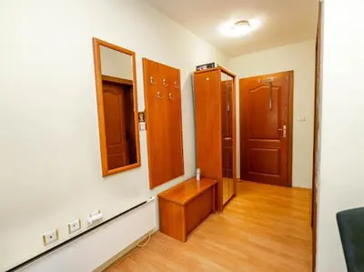 a room with a hallway with a mirror and a door at Apartmani Votor in Vrnjačka Banja