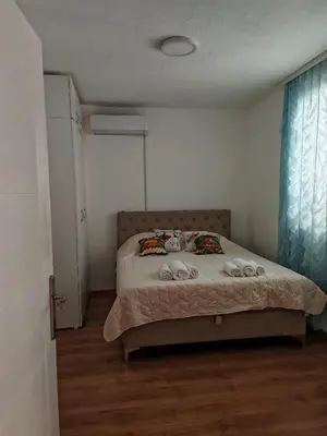 a bedroom with a bed with towels on it at Apartman-Stan in Jagodina