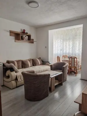 a living room with a couch and a table at Apartman-Stan in Jagodina