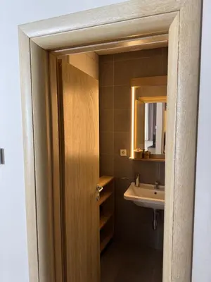 a bathroom with a sink and a mirror at Apartman Vila Jaram, Kopaonik in Kopaonik
