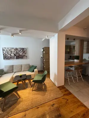 a living room with a couch and a table at Apartman Vila Jaram, Kopaonik in Kopaonik