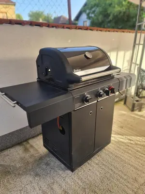 a grill sitting on top of a patio at Garden Lux Grujić Apartmani in Krivi Vir
