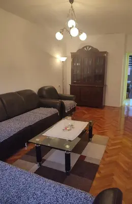 a living room with a couch and a coffee table at Apartman Orhideja in Knjazevac.