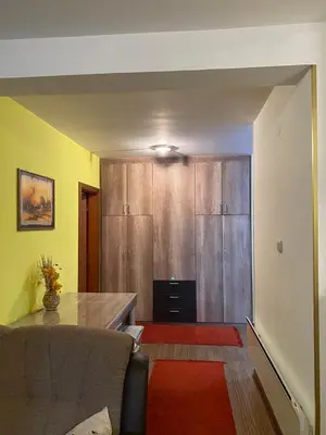 a living room with a couch and a table at Apartman Katić in Vrnjačka Banja