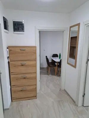 a bedroom with a dresser and a table in a room at You See Gold app in Pojate