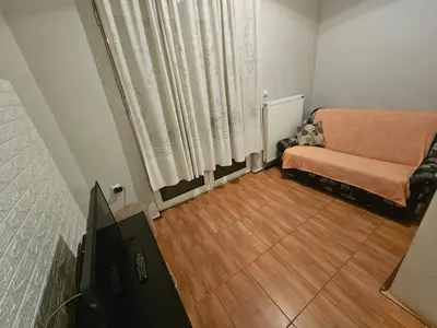 a living room with a couch and a television at Apartman K&M in Vranje