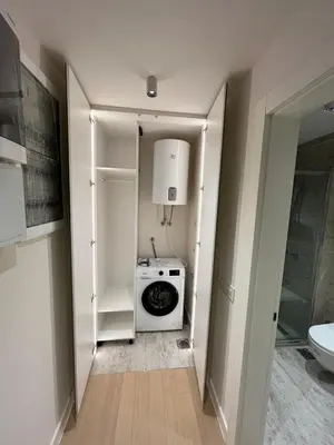 a laundry room with a washer and dryer in it at ZEPTERME Promenada - Šetalište in Vrnjačka Banja
