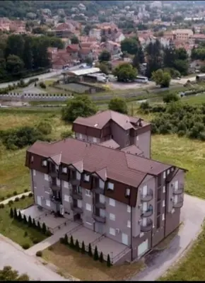 an aerial view of a large building in a field at Apartman Delux in Soko Banja