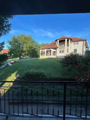 a view of a house from a balcony at Kuća Kostić in Gornja Toponica