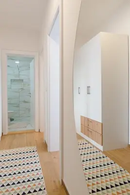 a mirror in a room with a bathroom at Apartman Stevanovic in Vrnjačka Banja