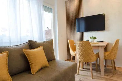 a living room with a couch and a table at Apartman Stevanovic in Vrnjačka Banja