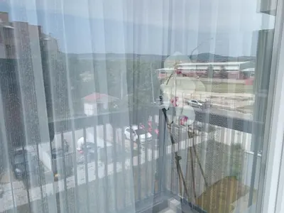 a window with a view of a city at Secret Spa Nis in Niš