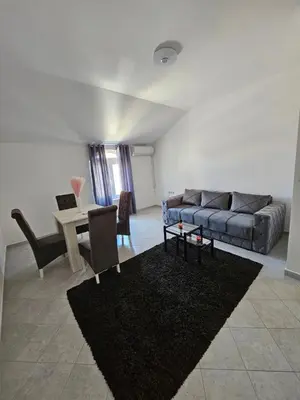 a living room with a couch and a table at Stan na dan Crystal in Paraćin