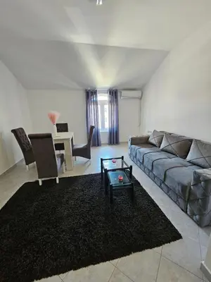 a living room with a couch and a table at Stan na dan Crystal in Paraćin