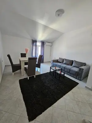 a living room with a couch and a table at Stan na dan Crystal in Paraćin