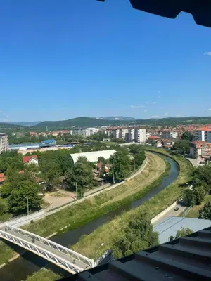 a bridge over a river in a city at Apartman Janković in Paraćin
