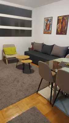 a living room with a couch and a table at Katarina in Niš