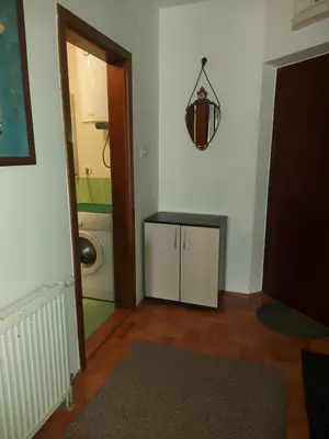 a laundry room with a washing machine and a washer at Katarina in Niš