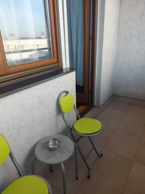a room with three chairs and a window at Katarina in Niš