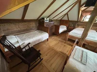 an overhead view of a bedroom with two beds and a chair at Brvnara 