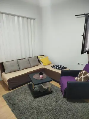 a living room with a couch and a table at Milić in Jagodina