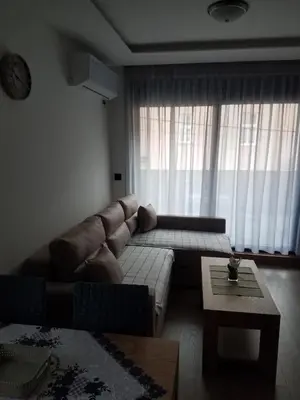 a living room with a couch and a coffee table at Four seasons in Vrnjačka Banja