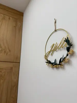 a wreath hanging on a wall in a room at Four seasons in Vrnjačka Banja