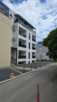 a white building on the side of a street at Four seasons in Vrnjačka Banja