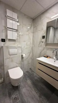 a bathroom with a toilet and a sink at Four seasons in Vrnjačka Banja