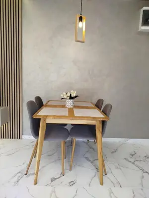 a dining room with a wooden table and chairs at Vista MDD in Soko Banja