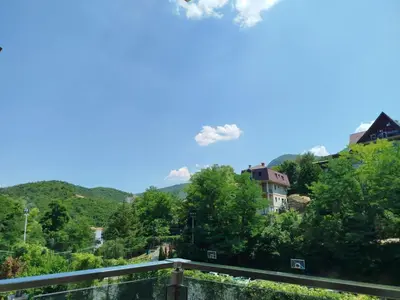 a view of the mountains from a balcony at Vista MDD in Soko Banja