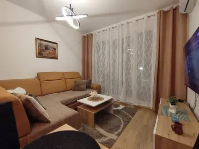 a living room with a couch and a table at Apartman Jeca in Vrnjačka Banja