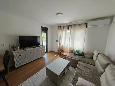 a living room with a couch and a flat screen tv at Grabak B3 in Vrnjačka Banja