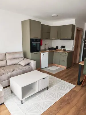 a living room with a couch and a white coffee table at Grabak B3 in Vrnjačka Banja