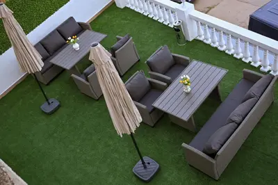 an aerial view of a patio with tables and umbrellas at Apartmani kod kumašina in Kuršumlija