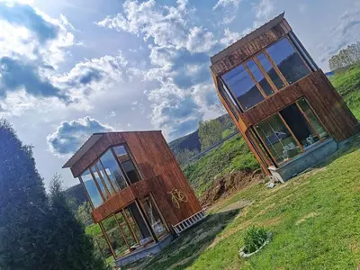 a house on top of a hill with glass at Milosev Konak