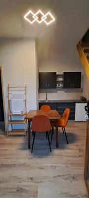 a kitchen with a table and chairs in a room at Milosev Konak