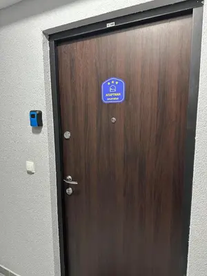 a wooden door with a sign on it at Zeus Apartman in Jagodina