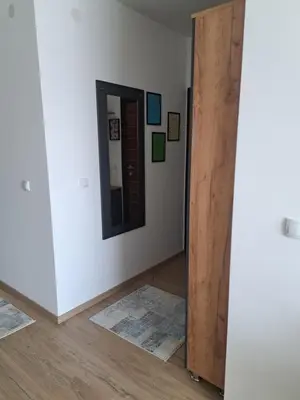 a room with a door and a mirror on a wall at Rajsko sunce in Vrnjačka Banja