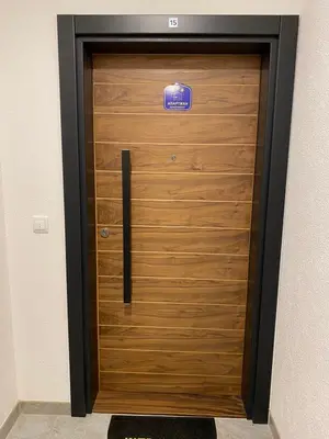 a large wooden door with a sign on it at Rajsko sunce in Vrnjačka Banja