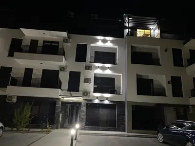 a building with a car parked in front of it at Rajsko sunce in Vrnjačka Banja