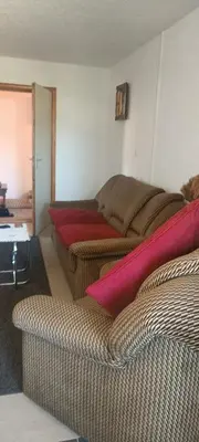 a living room with two beds and a couch at Apartman M&M in Jagodina