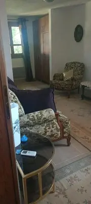 a living room with a couch and a table at Apartman M&M in Jagodina