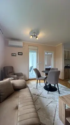 a living room with a couch and chairs and a table at Vrnjačka View apartments in Vrnjačka Banja