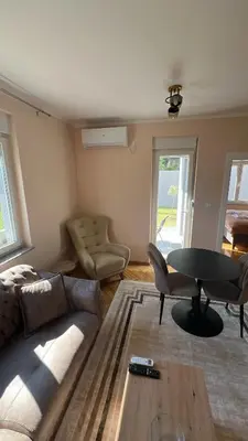 a living room with a couch and a table at Vrnjačka View apartments in Vrnjačka Banja